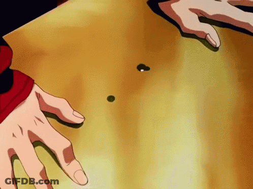 A Close Up Of A Person 'S Hands On A Table With A Green Ball On It GIF