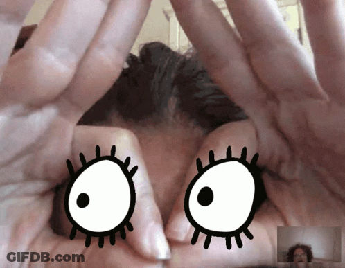 A Close Up Of A Person 'S Hands With A Cartoon Eye Drawn On Them GIF