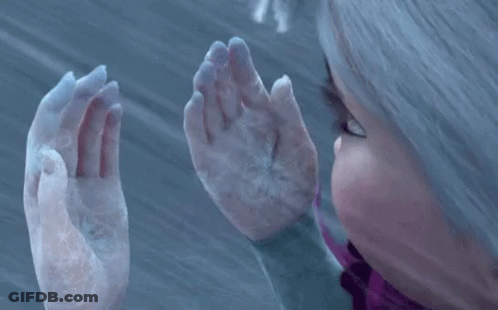 A Close Up Of A Person 'S Hands With Snow On Them . GIF
