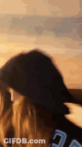 A Close Up Of A Person 'S Head With A Blurred Background GIF
