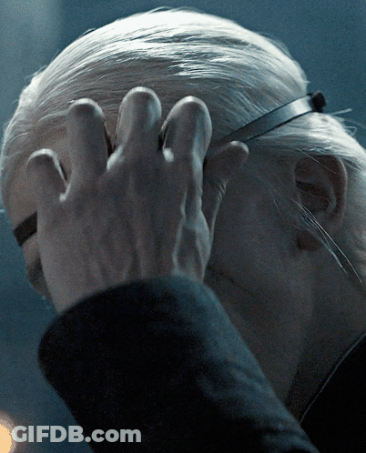 A Close Up Of A Person 'S Head With A Hand On It GIF
