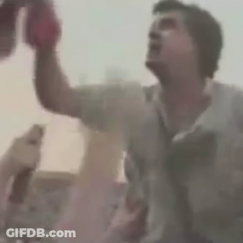 A Close Up Of A Person 'S Head With A Red Object On It . GIF