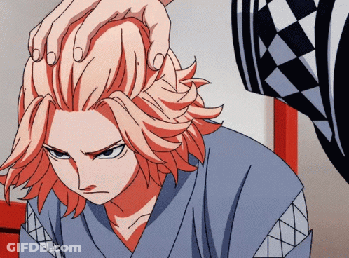 A Close Up Of A Person 'S Head With Their Hand On It GIF