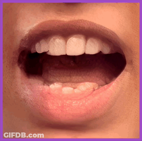 A Close Up Of A Person 'S Mouth And Teeth GIF