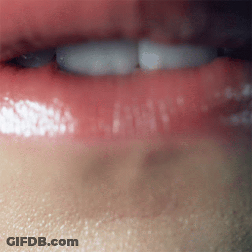 A Close Up Of A Person 'S Mouth With Red Lips GIF