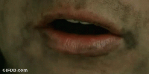 A Close Up Of A Person 'S Mouth With Red Lipstick And A Dirty Face . GIF