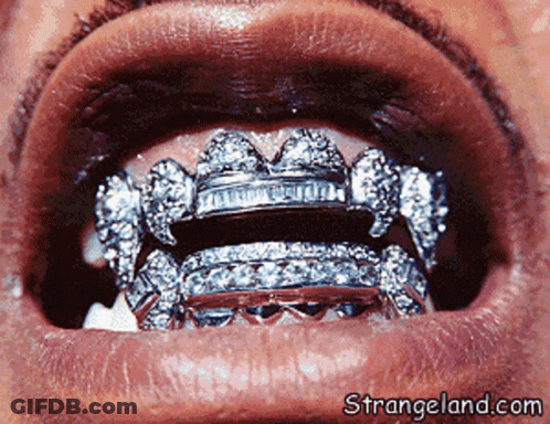 A Close Up Of A Person 'S Mouth With Strangeland.com In The Lower Right Corner GIF