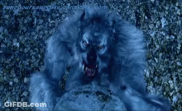A Close Up Of A Person 'S Mouth With Teeth Coming Out Of It 'S Mouth . GIF