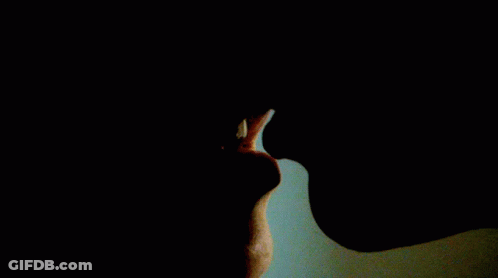A Close Up Of A Person 'S Mouth With Their Mouth Open GIF