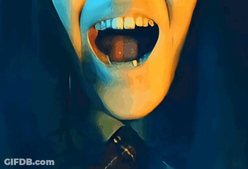 A Close Up Of A Person 'S Mouth With Their Tongue Hanging Out GIF