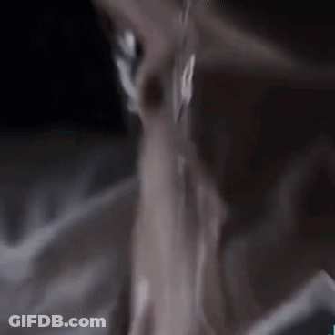 A Close Up Of A Person 'S Neck And Chest With Water Dripping From It . GIF