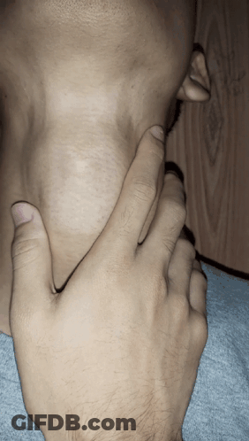 A Close Up Of A Person 'S Neck And Hand GIF