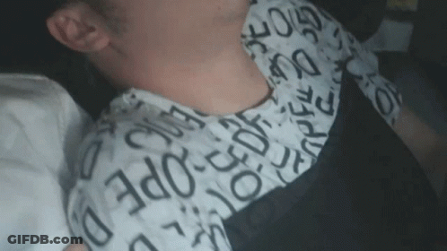 A Close Up Of A Person 'S Neck With A Shirt That Says ' Ec Ope ' On It GIF