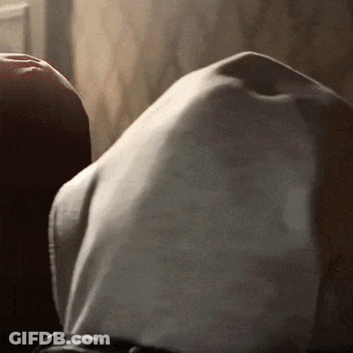 A Close Up Of A Person 'S Torso With A White Shirt On GIF