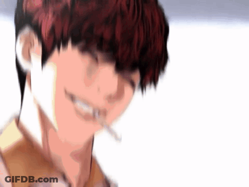 A Close Up Of A Person Smoking A Cigarette And Smiling . GIF