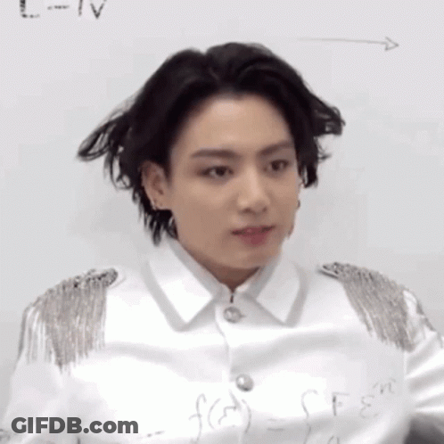 A Close Up Of A Person Standing In Front Of A White Board With A Formula Written On It . GIF