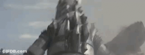A Close Up Of A Person Standing In The Middle Of A Field With Smoke Coming Out Of Their Mouth . GIF