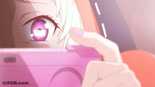 A Close Up Of A Person Taking A Picture With A Pink Phone GIF