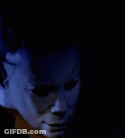 A Close Up Of A Person Talking On A Phone GIF
