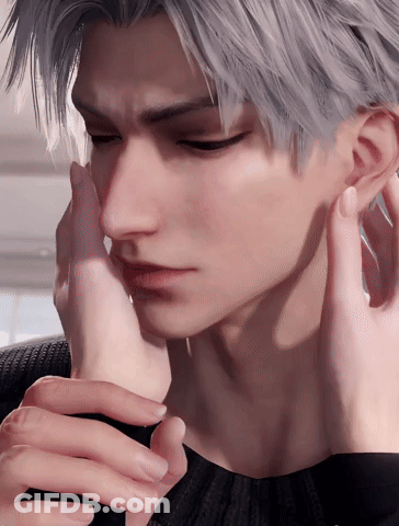 A Close Up Of A Person Touching A Man 'S Face With Their Hand GIF