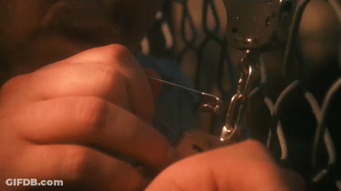 A Close Up Of A Person Using A Sewing Machine With The Letter N On It GIF
