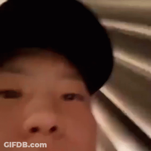 A Close Up Of A Person Wearing A Black Hat . GIF