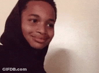 A Close Up Of A Person Wearing A Black Hoodie Making A Funny Face . GIF