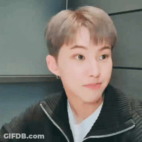 A Close Up Of A Person Wearing A Black Jacket And A White Shirt . GIF