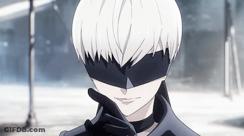A Close Up Of A Person Wearing A Black Mask GIF