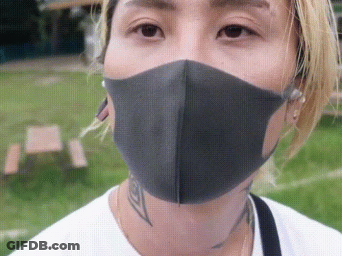 A Close Up Of A Person Wearing A Black Mask GIF