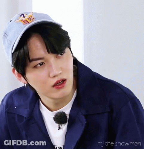 A Close Up Of A Person Wearing A Blue Jacket And A Hat With The Words Mj The Snowman On The Bottom GIF