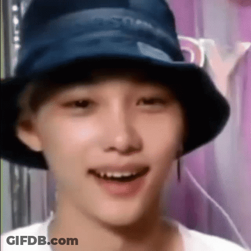 A Close Up Of A Person Wearing A Bucket Hat . GIF