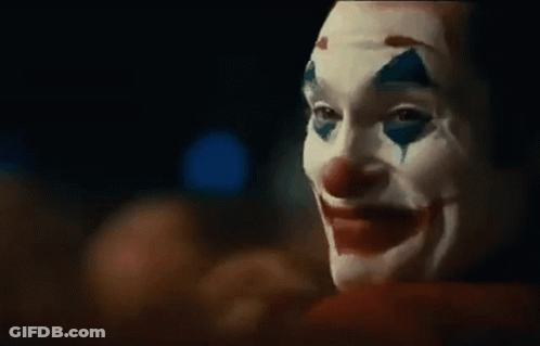 Person In Clown Mask With Blood On Face GIF