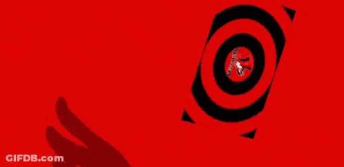 A Close Up Of A Person Wearing A Clown Mask With Red Eyes . GIF