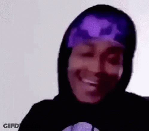 A Close Up Of A Person Wearing A Hoodie And A Purple Bandana . GIF