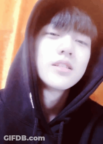 A Close Up Of A Person Wearing A Hoodie That Says Champion GIF