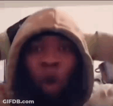 A Close Up Of A Person Wearing A Hoodie With A Surprised Look On Their Face . GIF