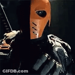 A Close Up Of A Person Wearing A Mask And Holding A Bow And Arrow . GIF
