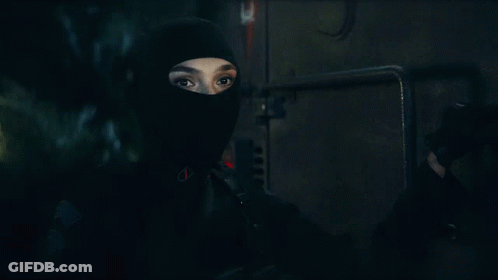 A Close Up Of A Person Wearing A Mask GIF