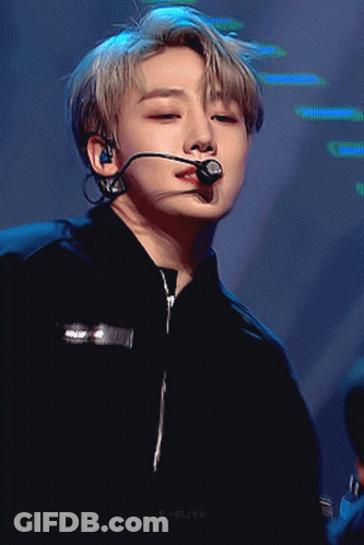 A Close Up Of A Person Wearing A Microphone And A Black Shirt GIF
