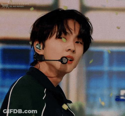 A Close Up Of A Person Wearing A Microphone In Their Ears . GIF