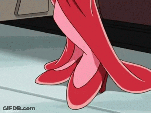 A Close Up Of A Person Wearing A Pair Of Red Shoes . GIF