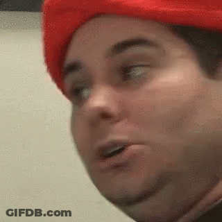 A Close Up Of A Person Wearing A Red Hat . GIF