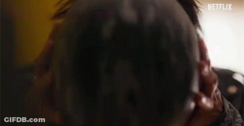 A Close Up Of A Person Wearing A Red Helmet And Sunglasses . GIF