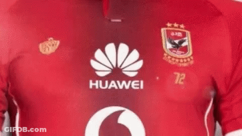 A Close Up Of A Person Wearing A Red Huawei Soccer Jersey . GIF
