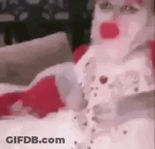 A Close Up Of A Person Wearing A Santa Claus Costume GIF