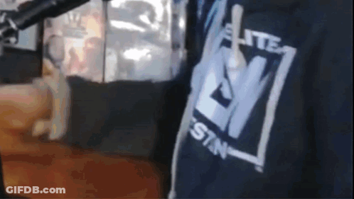 A Close Up Of A Person Wearing A Shirt That Says Elite Sin GIF