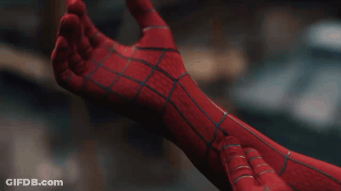 A Close Up Of A Person Wearing A Spiderman Suit GIF