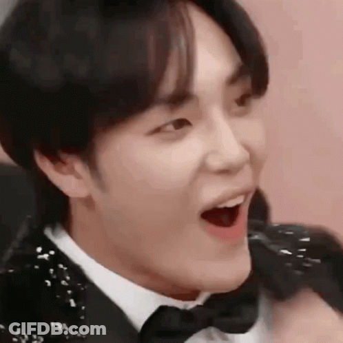 A Close Up Of A Person Wearing A Tuxedo And Bow Tie . GIF