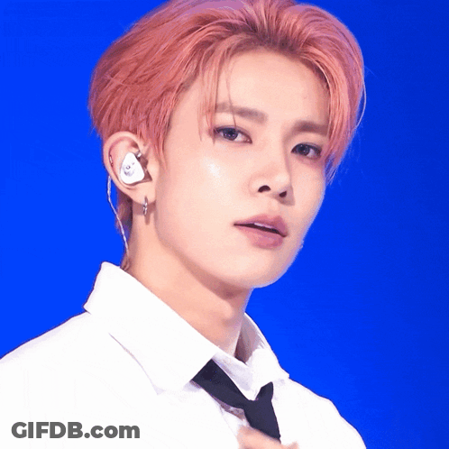 A Close Up Of A Person Wearing A White Shirt And Tie GIF